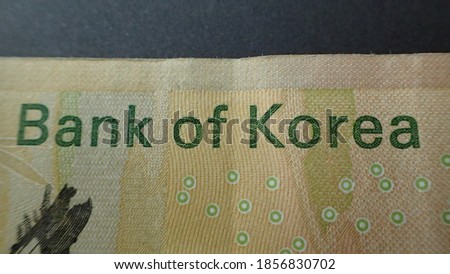 Money; Close up macro detail of Korean Won (KRW) banknotes; detail photo of Korean won.World money concept, inflation and economy concept.