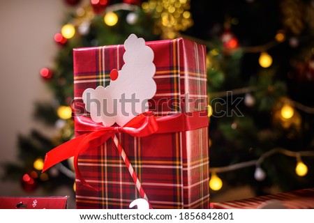 christmas presents under tree decorated with cartoon beards