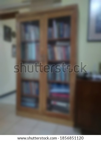 Blurred photo of a whole bookshelf