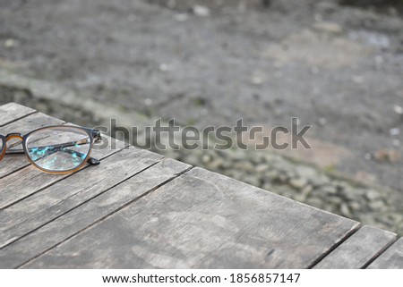 glasses with the nature and rustic background