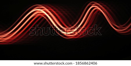 Neon light waves abstract in a black background