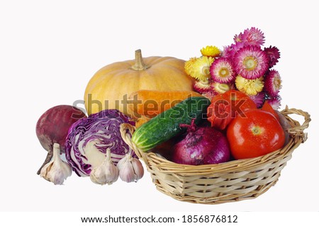 Diverse vegetables in a basket isolated on white.