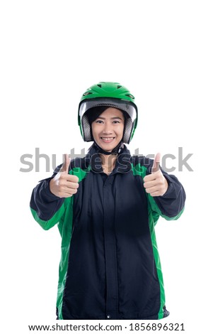 beautiful online taxi rider showing thumb up to camera