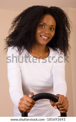 young woman exercising at home.