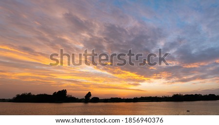 Colorful clouds and blue sky with the sunset for nature textured background Royalty-Free Stock Photo #1856940376