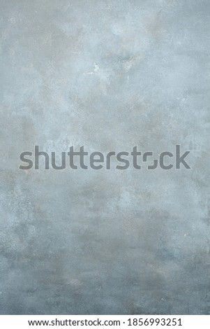 Romantic light grey hand-painted  textured shadow backdrop. wall of studio and muslin cloth  background