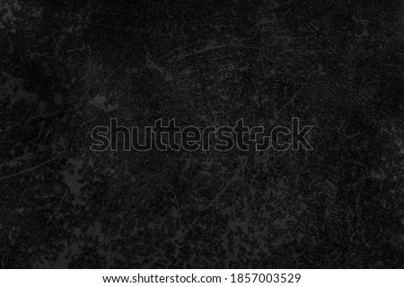 Dark concrete textured wall background.black grunge cement wall texture for interior design. dark edges.copy space for add text.