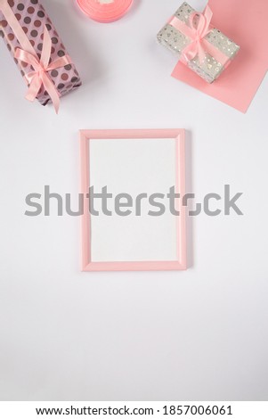 Valentines frame flat lay with gifts and pink ribbons. Birthday, Mothers day, Valentines day background with copy space, vertical, social media format.