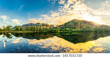 Buttermere lake panorama at sunrise. Lake District. England Royalty-Free Stock Photo #1857031720