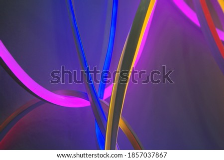 Colorful neon lights background. Texture design, bright poster. Led light background with lines. Technology  wallpaper.  