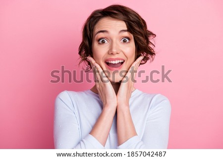 Astonished girl enjoy rejoice touch hands cheeks scream wear pullover isolated pastel color background