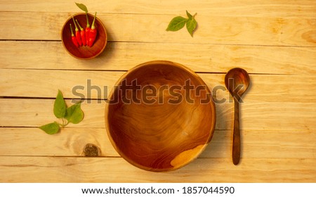 Empty wooden bowl on the table