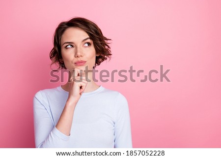 Focused smart girl look copyspace touch hand chin think decide wear pullover isolated pastel color background