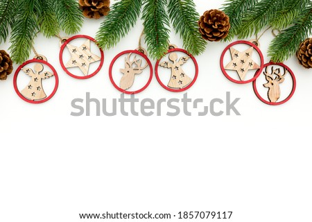 Spruce branch, cones and vintage toys decoration on christmas or new year on white background 
