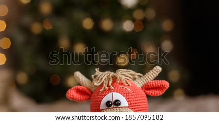 Crochet bull. Symbol of 2021. New year 2021 concept. Cozy Christmas concept. Place for your text.