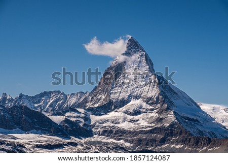 Classic view to Matterhorn on a sunny day with clear blue sky.