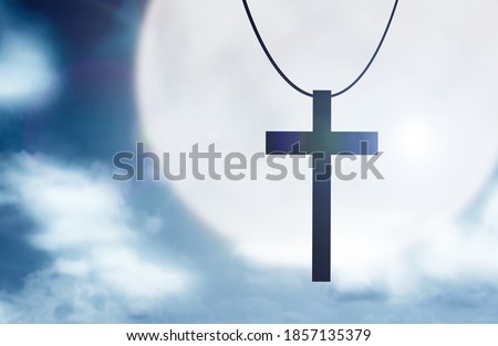 Image of Christian cross with the night scene background