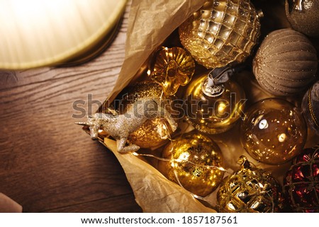 Christmas wooden table with lamp and brown balls decoration. Christmas holiday celebration, winter, New Year concept.  Flat lay, top view