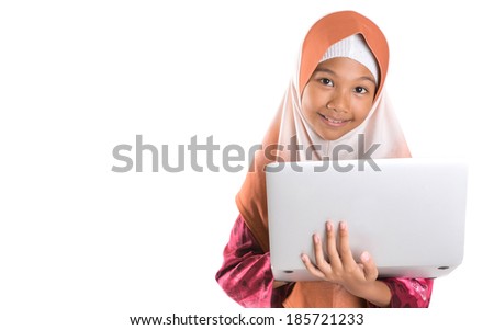 Young Asian Malay Muslim girl in modern hijab with a laptop over white background