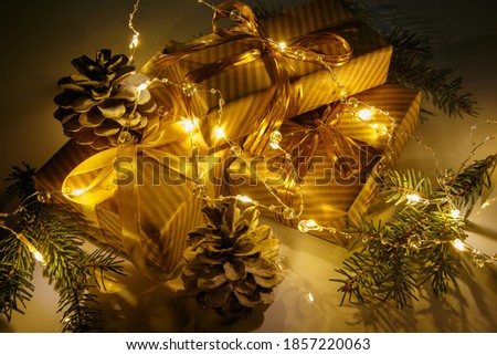 Christmas or new year composition, golden christmas decorations, gifts and lights