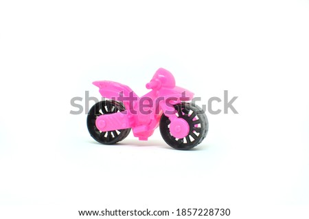 Pink Toy motorcycle isolated on white background.