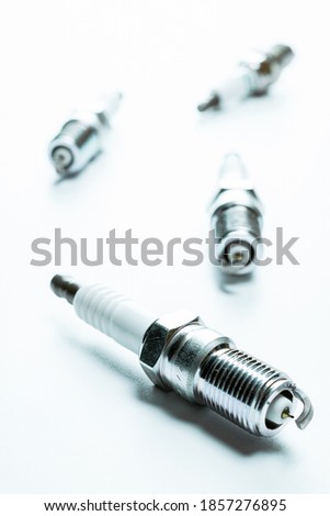 Car parts. Set of new metal car part. Auto spark plugs or automotive piece isolated on white background. Technology of mechanical gear.