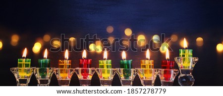 Religion image of jewish holiday Hanukkah background with menorah (traditional candelabra) and candles
