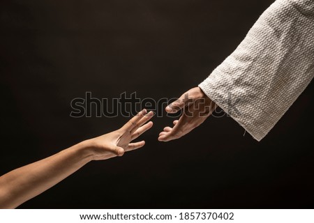 Jesus Christ rescuing and saving a sinner during the dark night. Royalty-Free Stock Photo #1857370402
