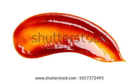 Smear of barbecue sauce or ketchup isolated on white background, close up. Royalty-Free Stock Photo #1857372493