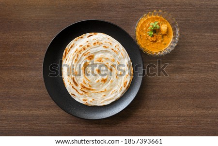 Malabar fresh homecooked parotta, handmade recipe, paneer curry side dish. Authentic south indian food. Royalty-Free Stock Photo #1857393661