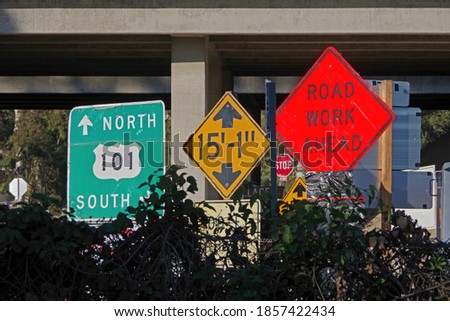 Close look at a conglomerate of too many signs in one view and location