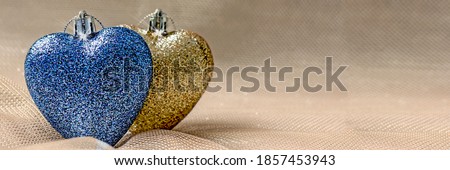 Valentine's Day banner with hearts. Two glowing hearts of silver and blue color next to each other. Set Sail Champagne color, trend color 2021, copy space