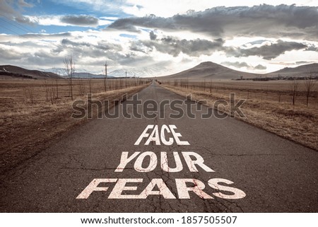 face your fears on asphalt road
