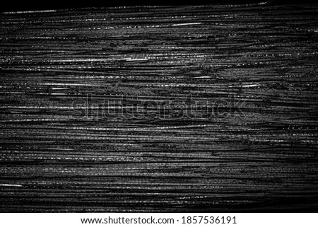 Noisy black striped surface background. Metal black white stripes. Abstract glitch art effect.