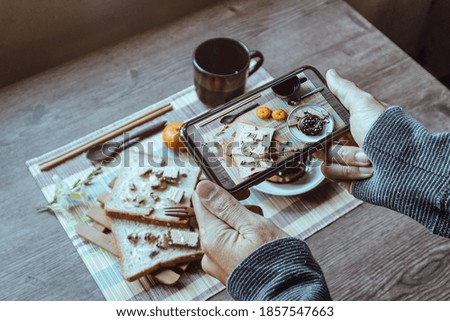 People taking food photo with smartphone, Winter breakfast, Close up.