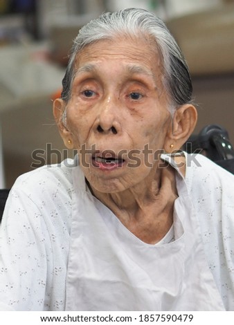 Soft focus of  a  face expression portrait of an Asian Old lady 