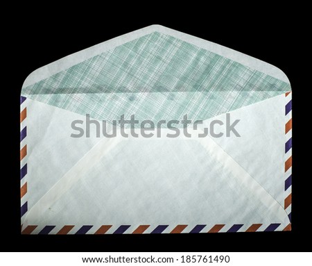 Open vintage envelope on black background. Red and blue lines