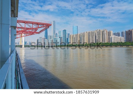 The Lide bridge on the Pearl River and the skyline of modern urban buildings on both sides of the Pearl River in Guangzhou City, Guangdong Province, China