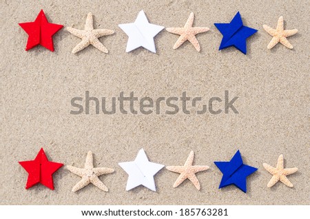 American holidays background with starfishes and color stars on the sand