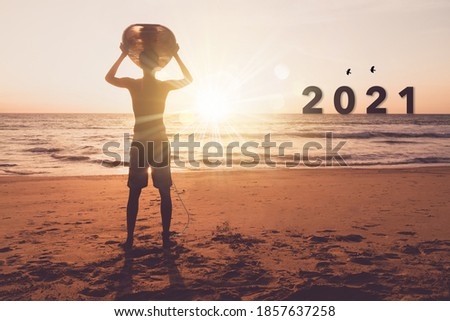 New year 2021 is coming with sunset beach background. New start for planing or set new resolution in life .Business solution. 