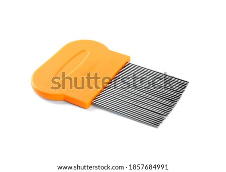 Metal comb for removing lice isolated on white