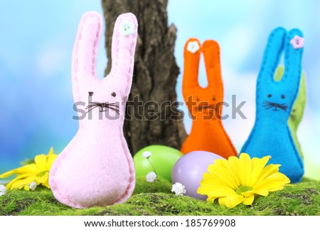 Funny handmade Easter rabbits on nature background