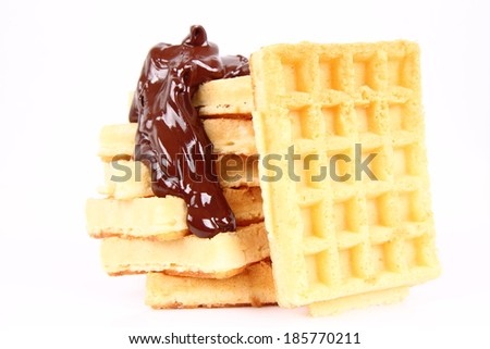 Waffles covered with chocolate on a white background