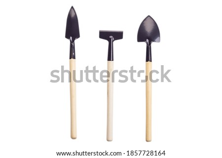 Floriculture tools set isolated on white background, shovel, rake, scoop, metal tool with wooden handle Royalty-Free Stock Photo #1857728164