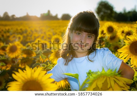 September 2020, Bibbiano, Italy. Sweet little girl in a sunflower field