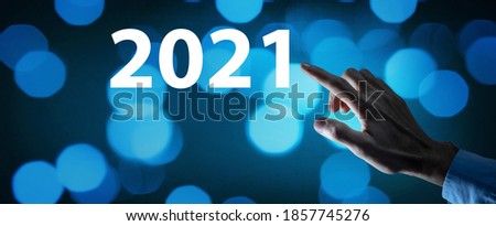 Businessman touching screen circa 2021