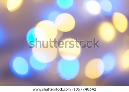 Festive garland bokeh background defocused. Background for greeting cards and postcards. Round bokeh balls. Round bokeh light.