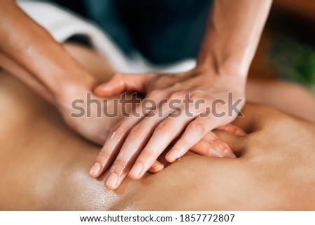 Ayurveda Back Massage with aromatherapy essential oil Royalty-Free Stock Photo #1857772807