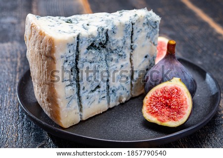 Cheese collection, piece of italian blue cheese gorgonzola picante with blue mold from north of Italy close up Royalty-Free Stock Photo #1857790540