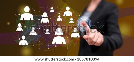 Woman touching a social network concept on a touch screen with her finger